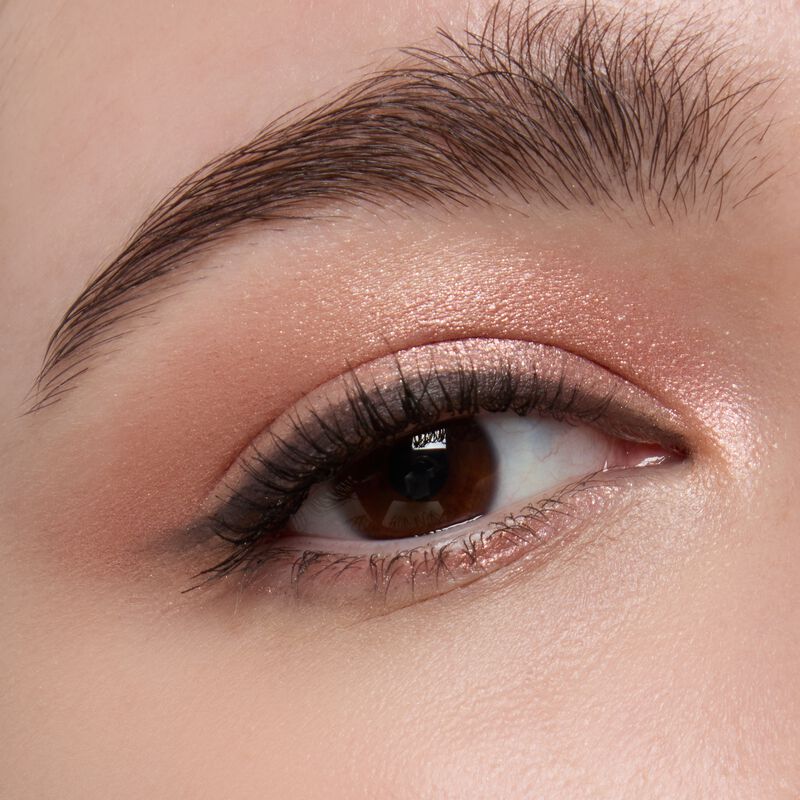 Light skinned model wearing Mary kay Eye Shadow Sticks in shades Copper Nova and Black Obsidian